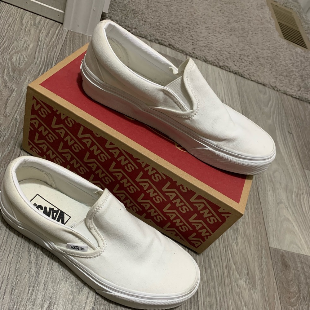 All white slip on Vans